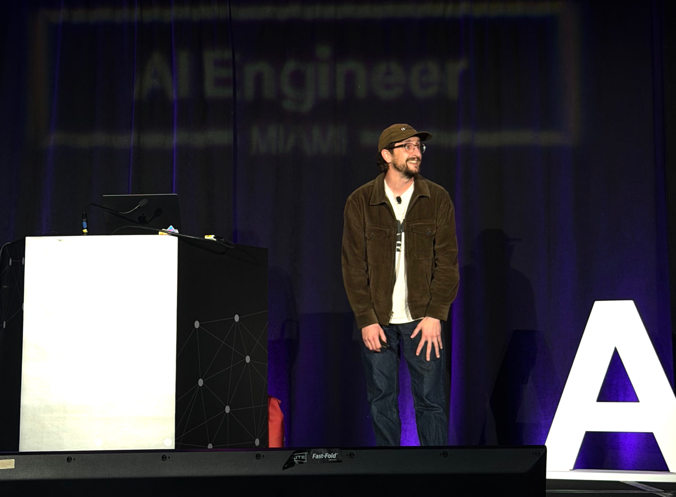 Dave Kiss speaking on stage